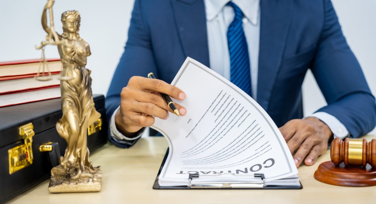 Male Asian lawyer in formal suit handles contracts, agreements, legal obligations, rights liberties