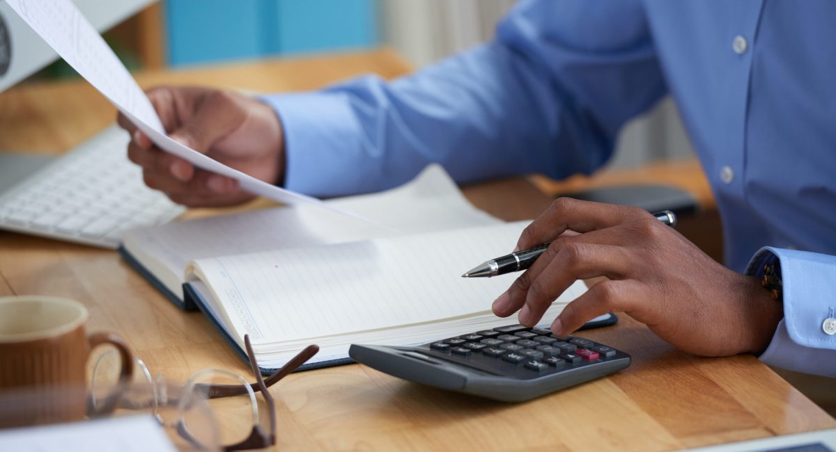 Close-up image of financial managers working with reports